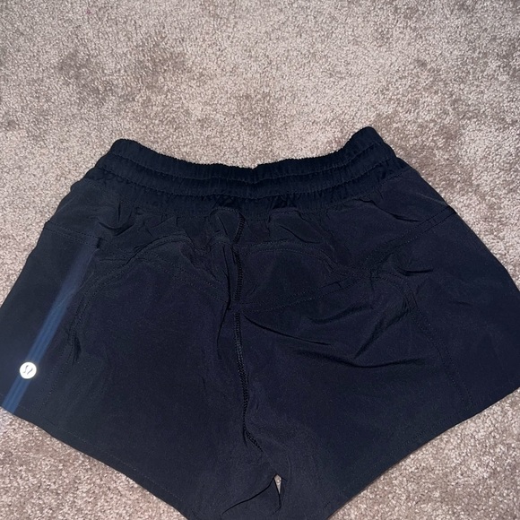 Lululemon track that shorts size 4 black low rise - Picture 2 of 4